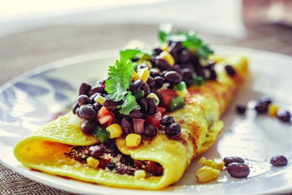 ovovegetarian omelette dish with beans and corn