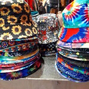 Fripsap vintage and thrift store shopping in Montpellier France with fun tie dye bucket hats